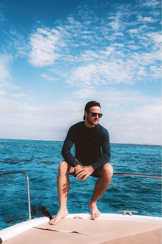Herr Krank on the bow of a boat in the New Caledonian lagoon
