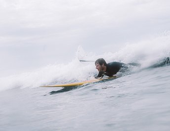 Surfing the outer reef of the world's largest lagoon